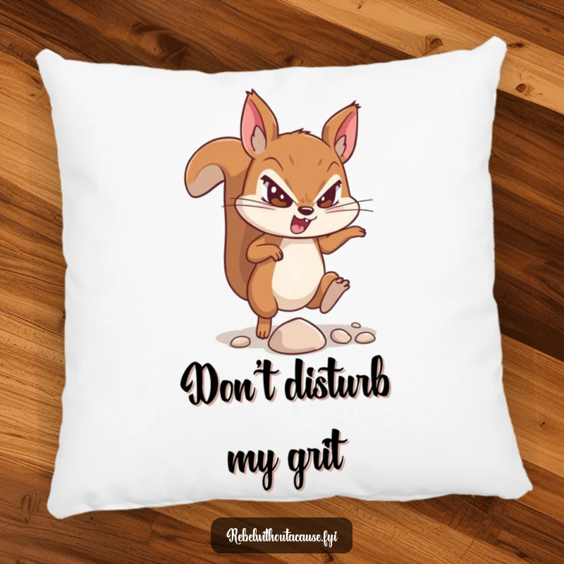 Funny pillow showcasing a determined squirrel character, captured mid-kick of a tiny pebble, exuding defiance.
