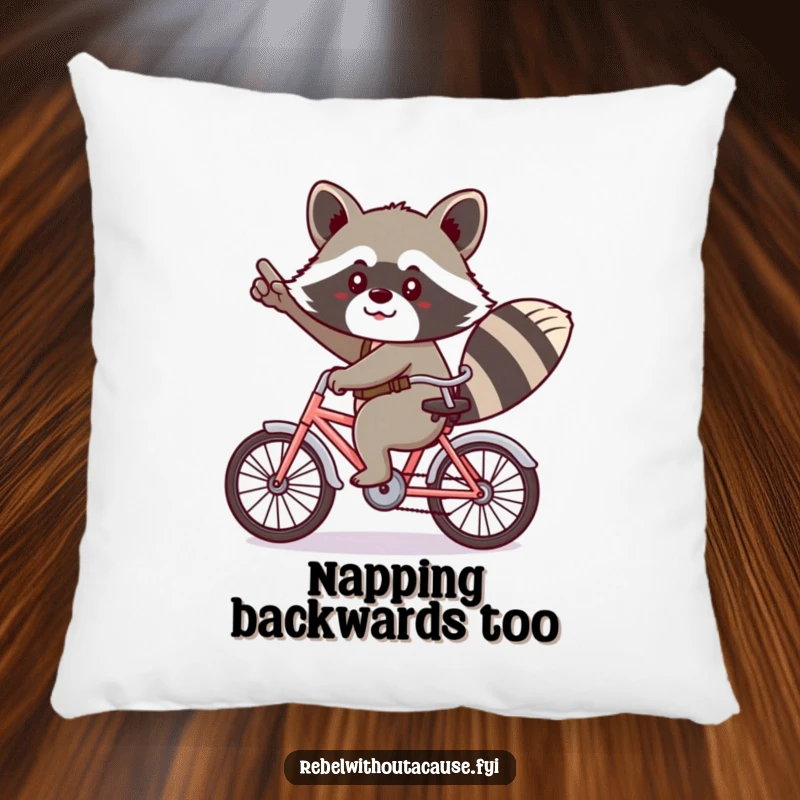 Funny kawaii raccoon giving a cheeky salute, riding a tiny bicycle backwards on a pillow.
