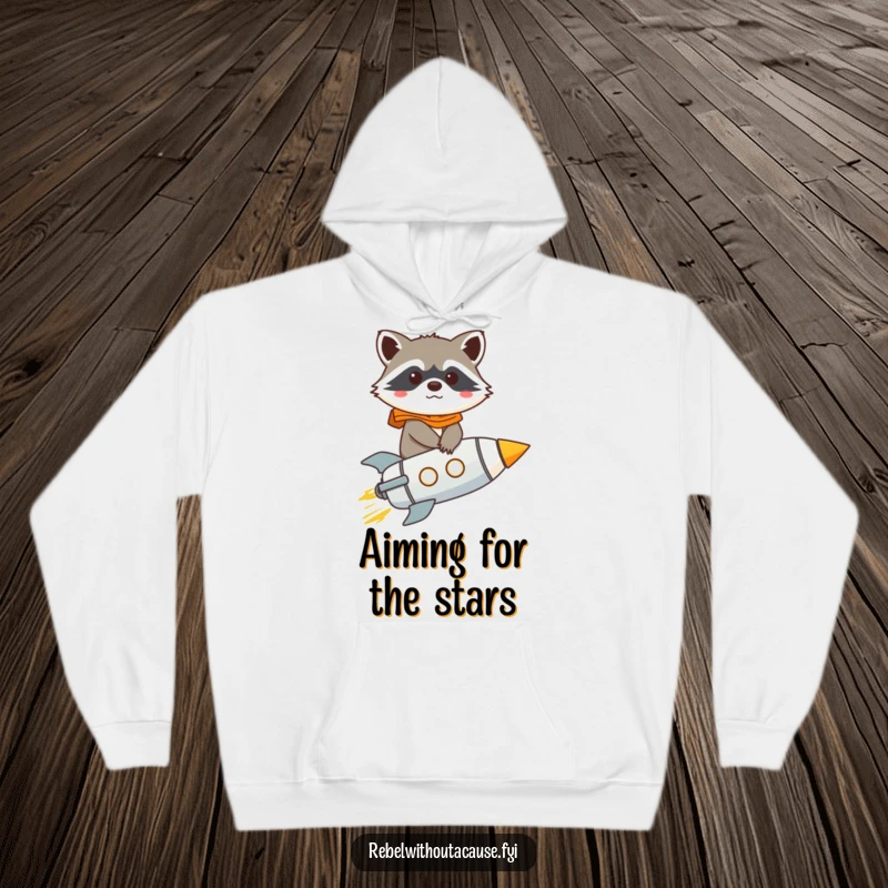Cozy up in this funny raccoon rocket hoodie, featuring a determined raccoon blasting off into the unknown with a giggle.