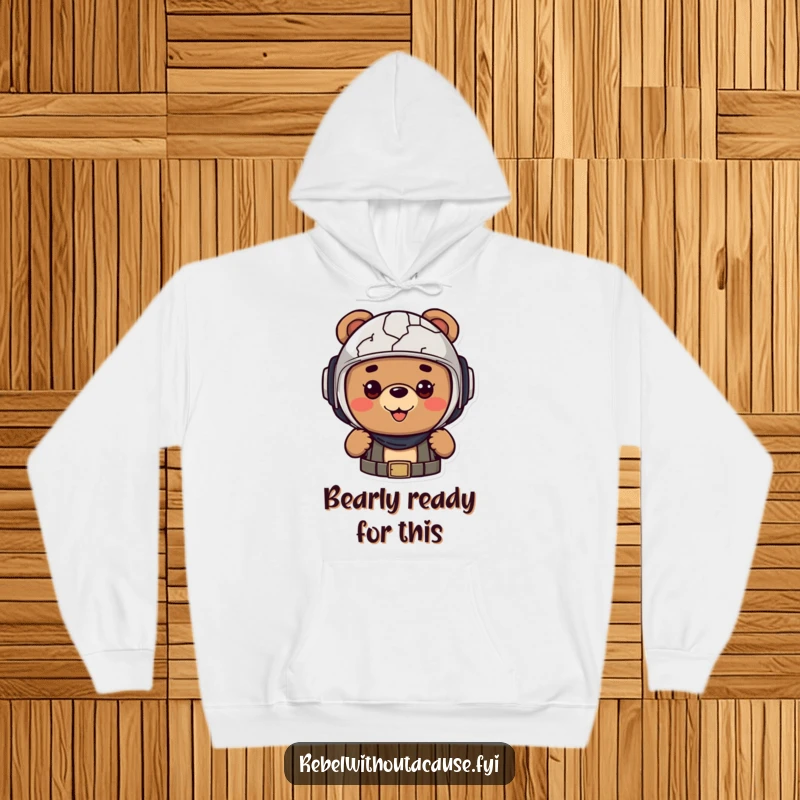 Funny hoodie of a cheerful bear character wearing a cracked helmet, looking optimistic and ready for any challenge.