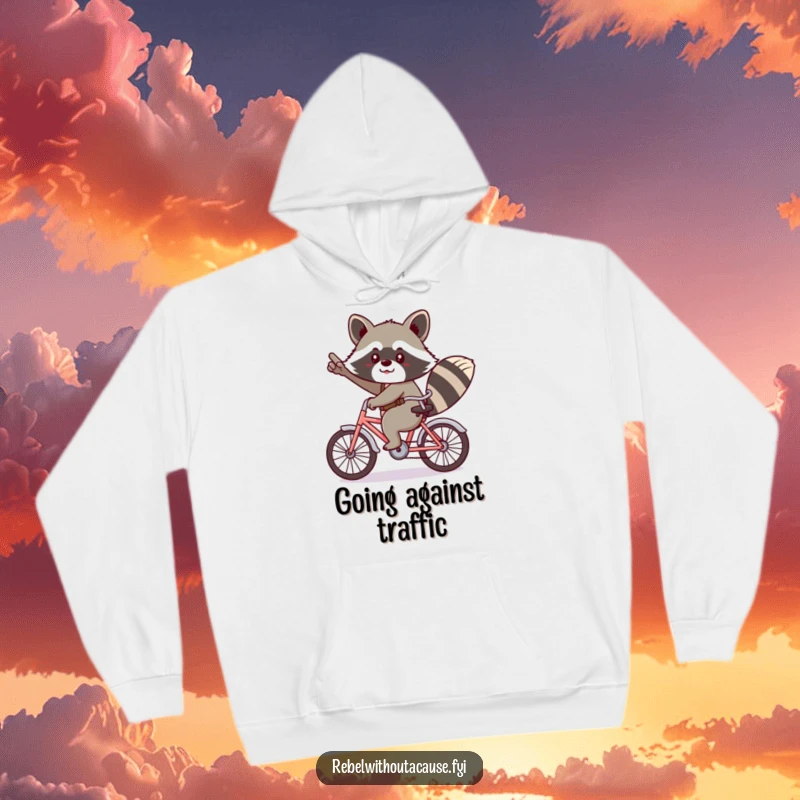 Funny kawaii raccoon giving a cheeky salute, riding a tiny bicycle backwards on a hoodie.