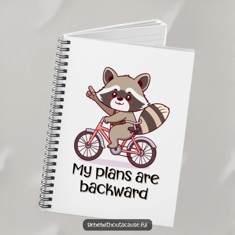 Funny kawaii raccoon giving a cheeky salute, riding a tiny bicycle backwards on a notebook.